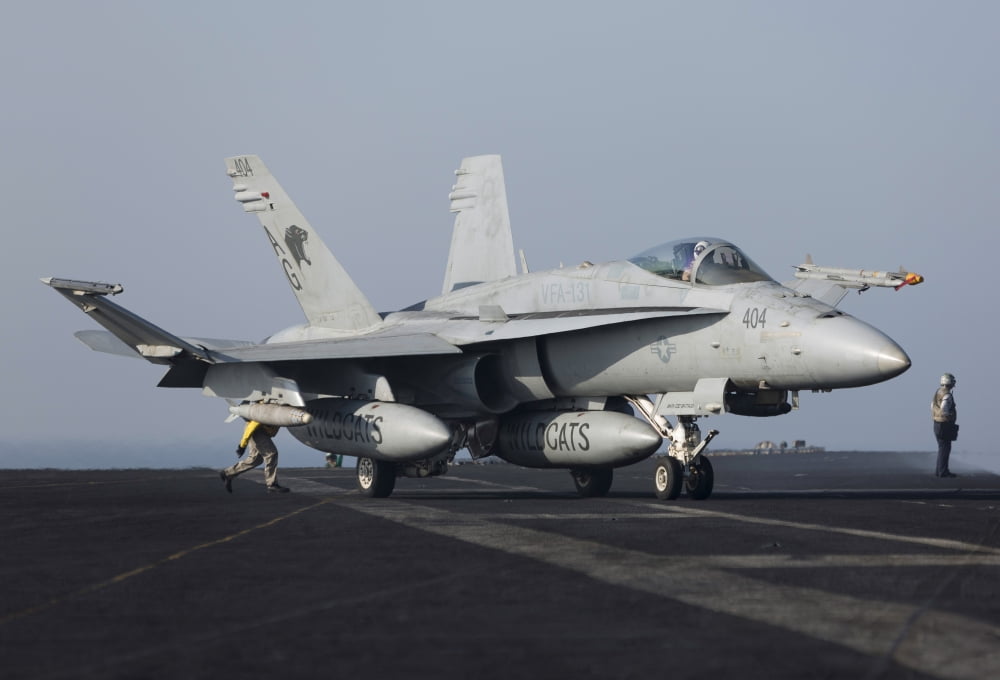 An FA-18C Hornet during flight operations on USS Dwight D Eisenhower Canvas Art - Gert KromhoutStocktrek Images (17 x 12)