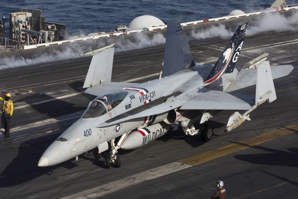 An FA-18C Hornet during flight operations on USS Dwight D Eisenhower Canvas Art - Gert KromhoutStocktrek Images (17 x 12)