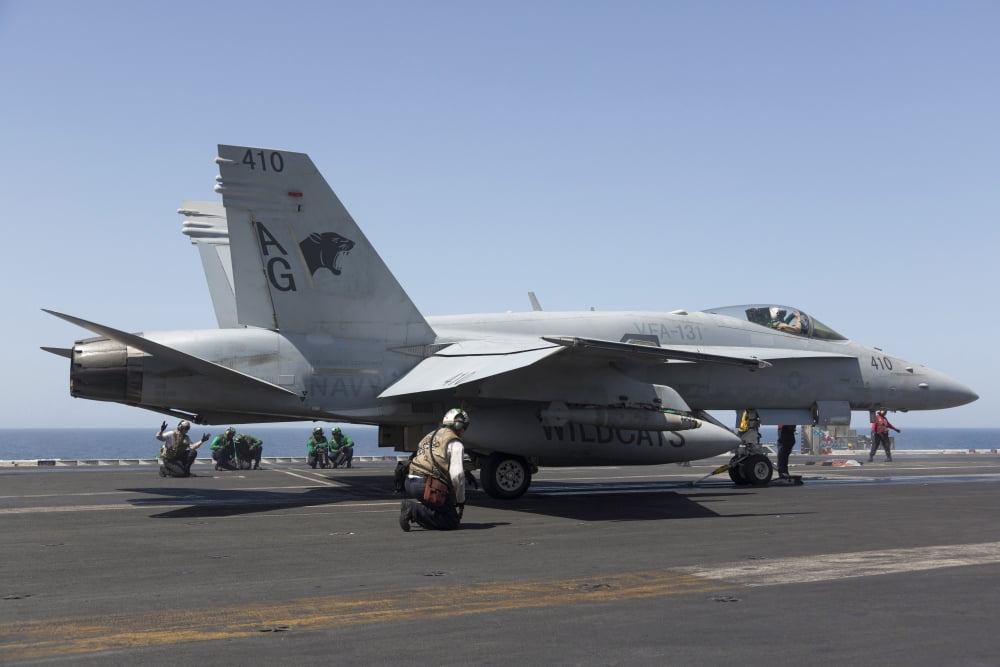 An FA-18C Hornet during flight operations on USS Dwight D Eisenhower Canvas Art - Gert KromhoutStocktrek Images (18 x 12)