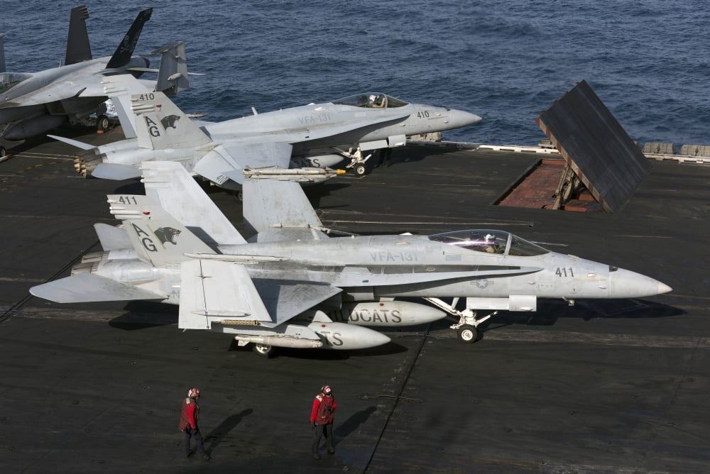 An FA-18C Hornet during flight operations on USS Dwight D Eisenhower Canvas Art - Gert KromhoutStocktrek Images (18 x 12)