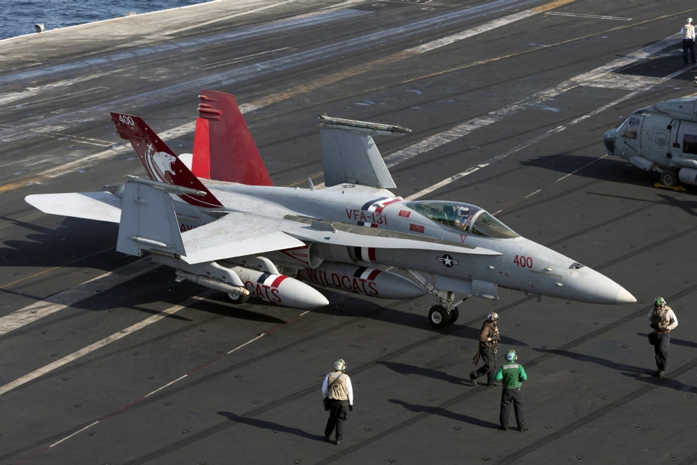 An FA-18C Hornet during flight operations on USS Dwight D Eisenhower Canvas Art - Gert KromhoutStocktrek Images (35 x 23)