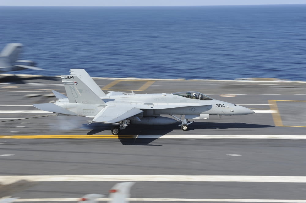 An FA-18C Hornet lands aboard USS George HW Bush Canvas Art - Stocktrek Images (35 x 23)