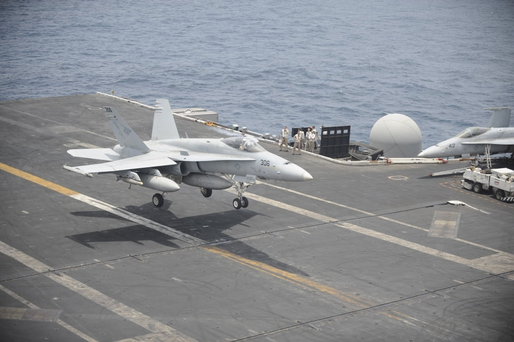 An FA-18C Hornet lands on the flight deck of USS Nimitz Canvas Art - Stocktrek Images (35 x 23)