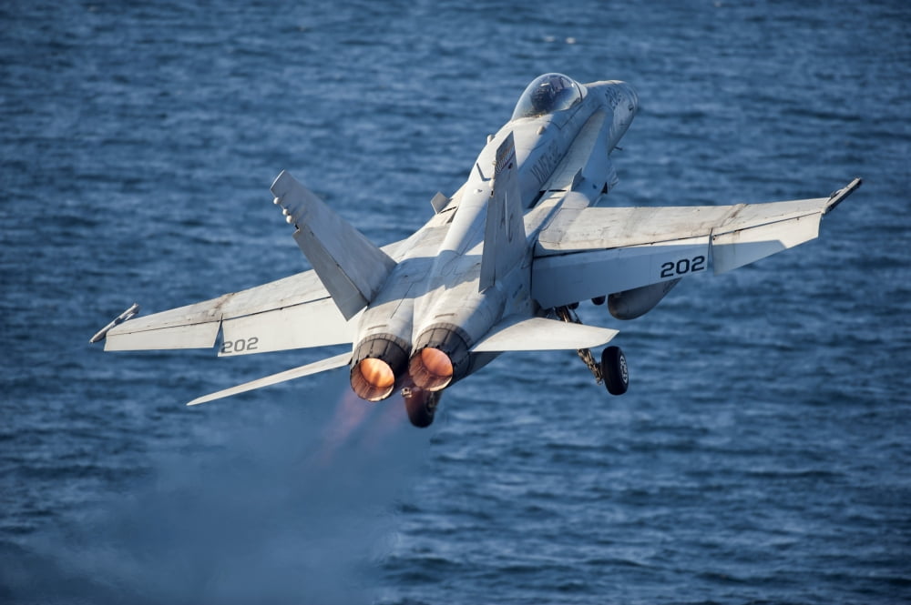 An FA-18C Hornet launches from the flight deck of USS Harry S Truman Canvas Art - Stocktrek Images (34 x 23)
