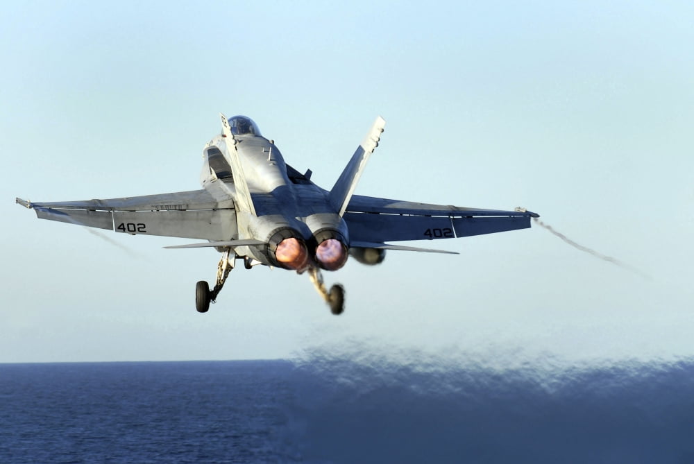 An FA-18C Hornet launches from the flight deck of USS John C Stennis Canvas Art - Stocktrek Images (34 x 23)