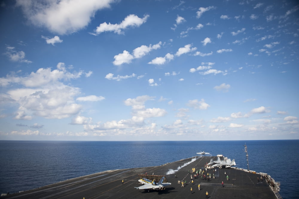 An FA-18C Hornet launches from the flight deck of USS Nimitz Canvas Art - Stocktrek Images (34 x 23)