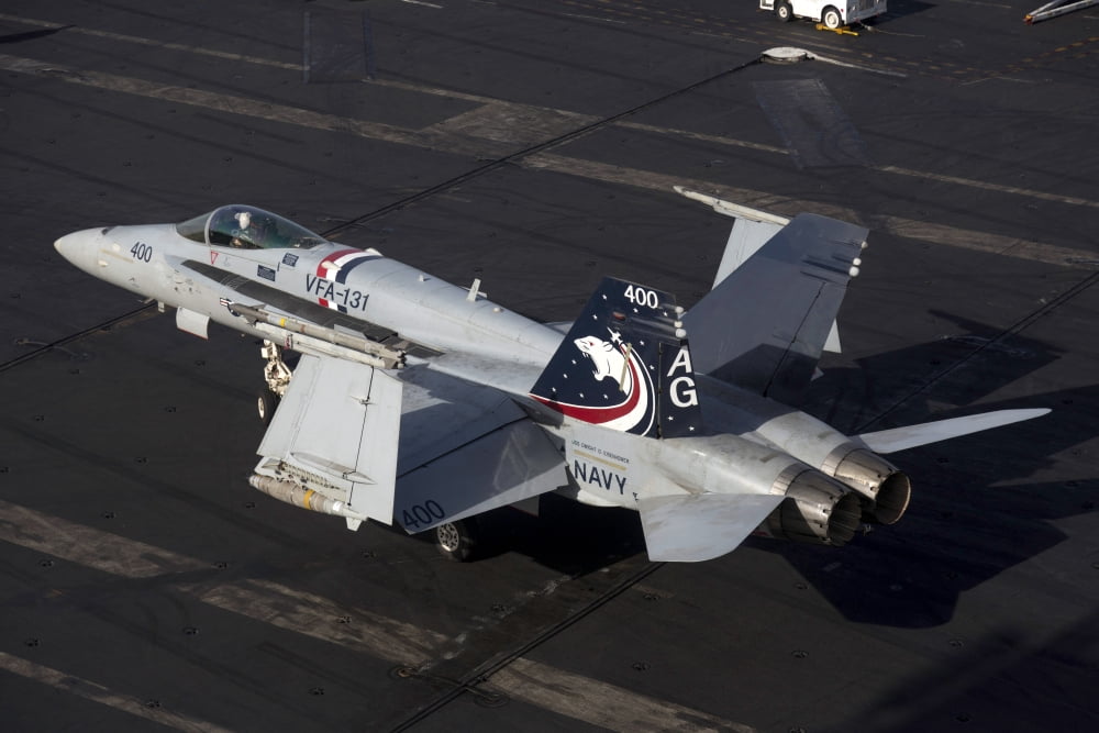An FA-18C Hornet on the flight deck of USS Dwight D Eisenhower Canvas Art - Gert KromhoutStocktrek Images (35 x 23)