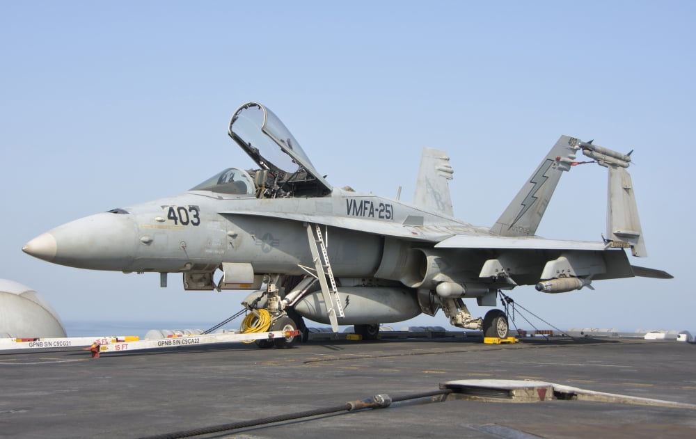 An FA-18C Hornet on the flight deck of USS Theodore Roosevelt Canvas Art - Giovanni CollaStocktrek Images (35 x 22)