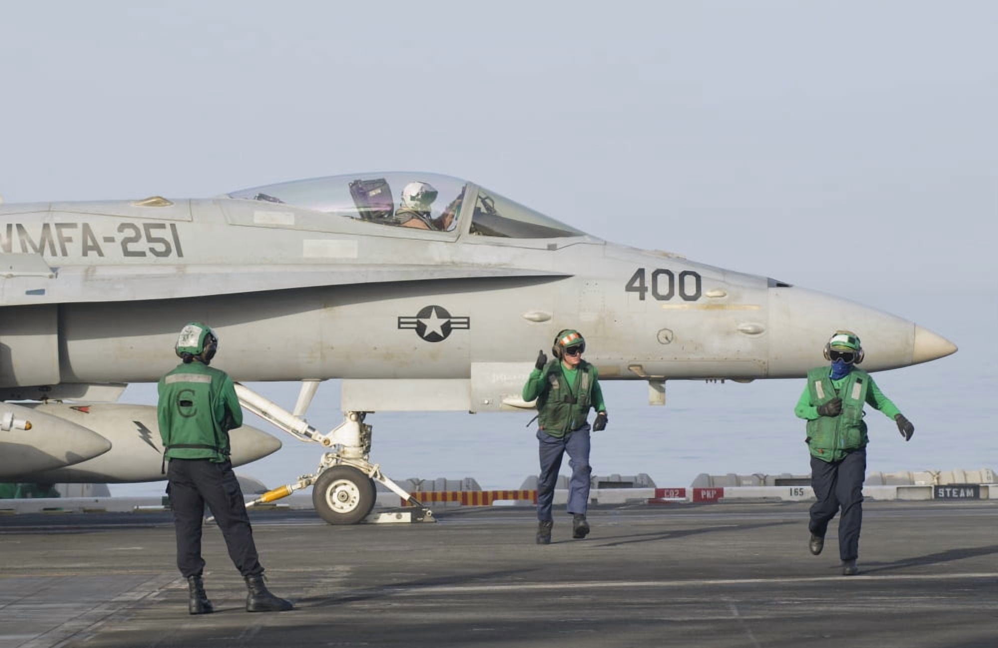An FA-18C Hornet ready to launch from a catapult board USS Theodore Roosevelt Canvas Art - Giovanni CollaStocktrek Images (35 x 23)