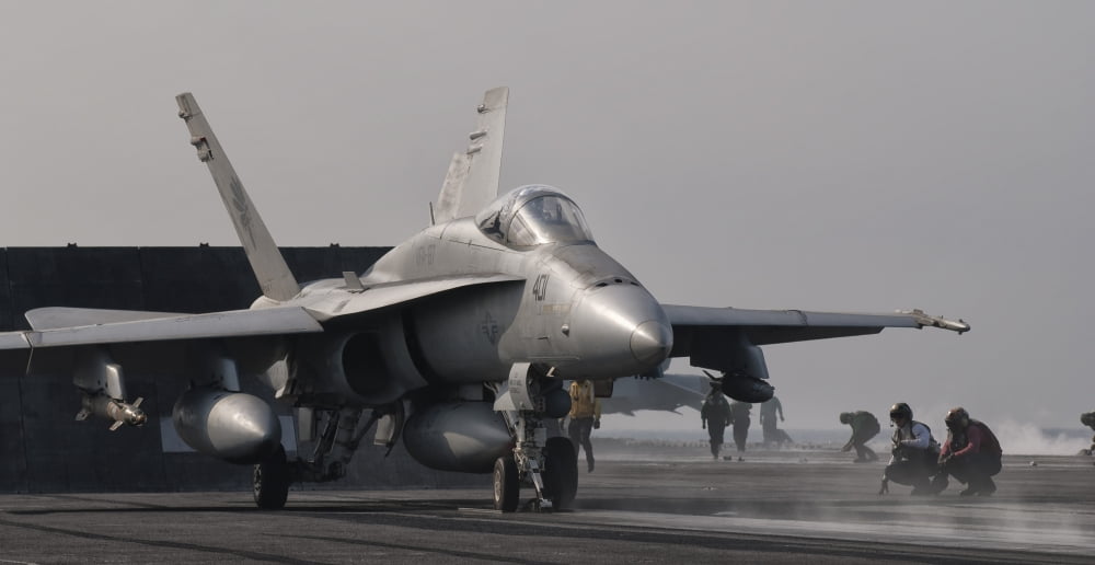 An FA-18C Hornet ready to launch from the flight deck of USS George HW Bush Canvas Art - Giovanni CollaStocktrek Images (39 x 21)