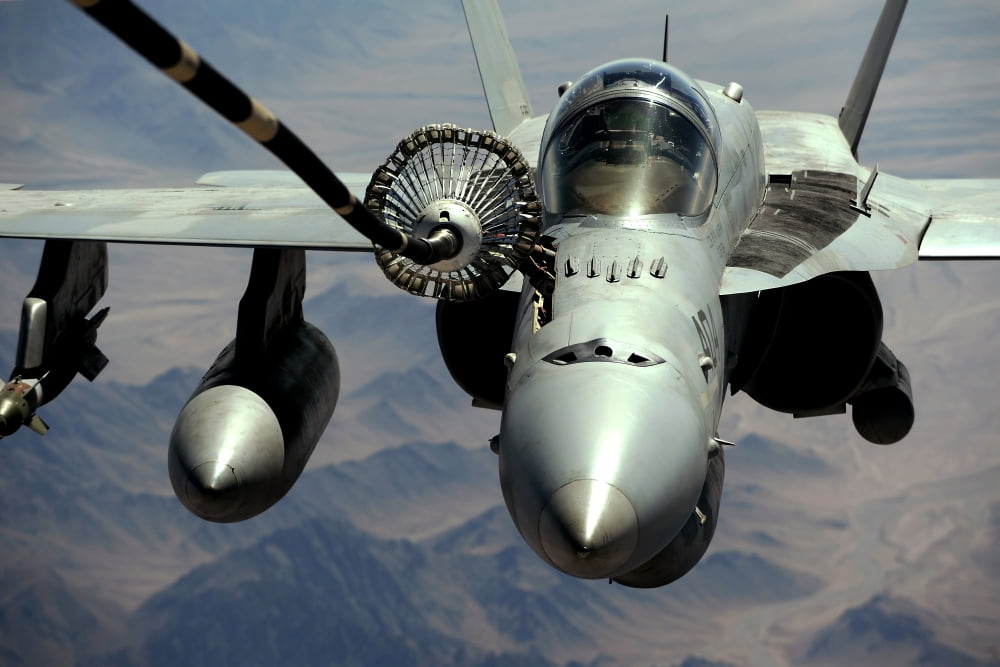 An FA-18C Hornet receives fuel from the drogue of a KC-10 Extender Canvas Art - Stocktrek Images (35 x 24)