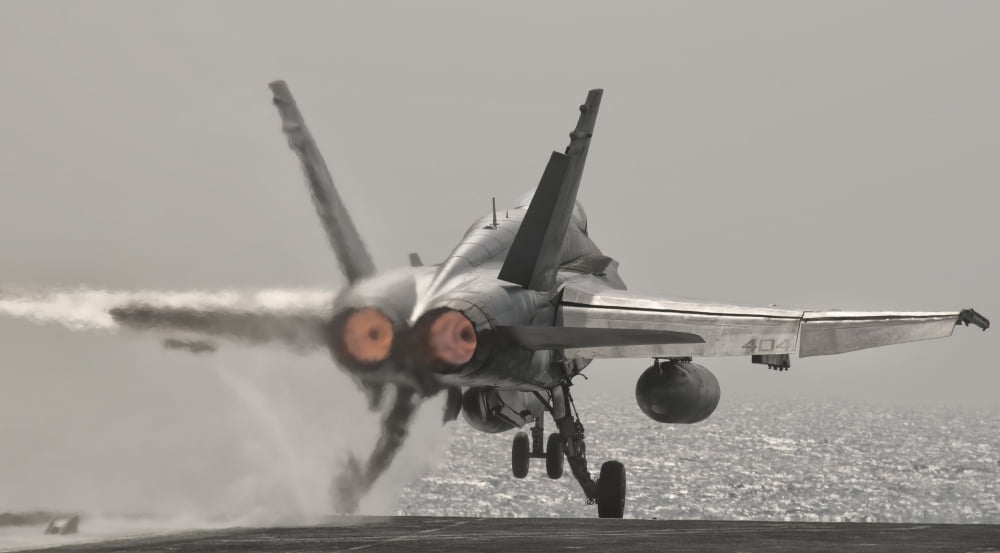 An FA-18C Hornet takes off from USS George HW Bush Canvas Art - Giovanni CollaStocktrek Images (19 x 11)