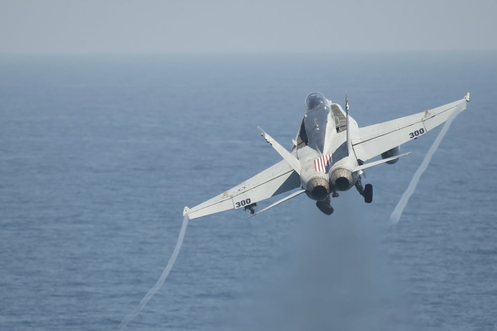 An FA-18C Hornet taking off Canvas Art - Stocktrek Images (35 x 23)