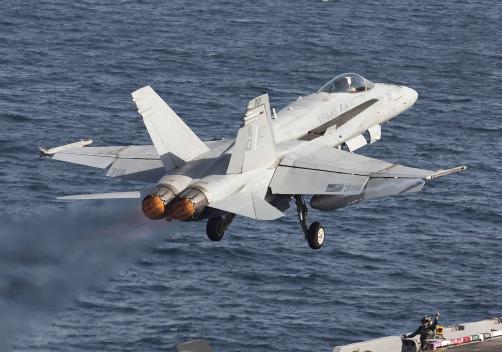 An FA-18C Hornet taking off during flight operations on USS Dwight D Eisenhower Canvas Art - Gert KromhoutStocktrek Images (17 x 12)