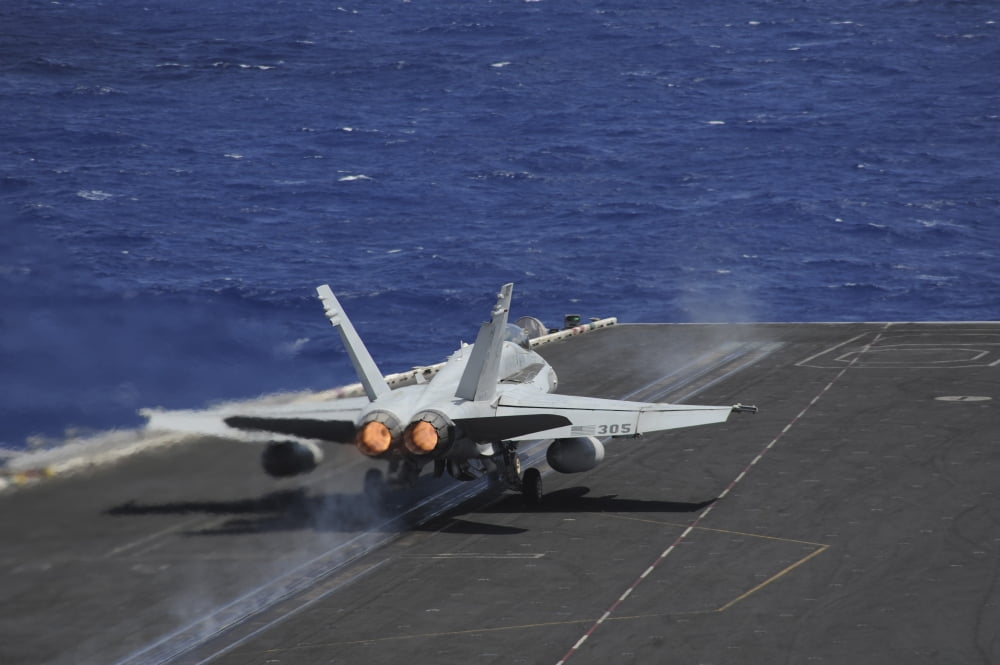 An FA-18C Hornet taking off from USS Dwight D Eisenhower Canvas Art - Stocktrek Images (35 x 23)