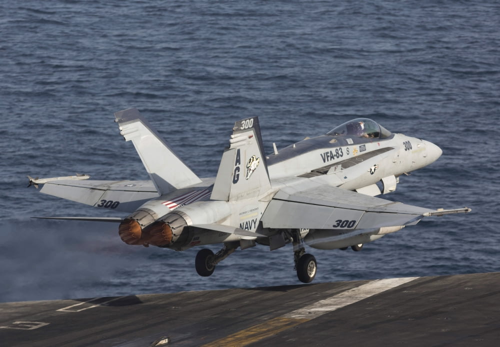 An FA-18C Hornet taking off from the flight deck of USS Dwight D Eisenhower Canvas Art - Gert KromhoutStocktrek Images (34 x 23)