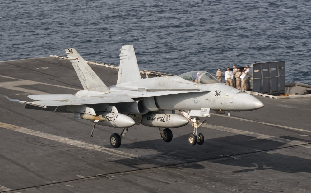 An FA-18C Hornet trap landing aboard USS George HW Bush Canvas Art - Giovanni CollaStocktrek Images (18 x 11)