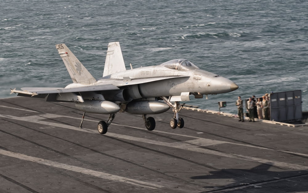 An FA-18C Hornet trap landing aboard USS George HW Bush Canvas Art - Giovanni CollaStocktrek Images (18 x 12)