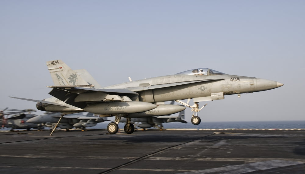 An FA-18C Hornet trap landing aboard USS George HW Bush Canvas Art - Giovanni CollaStocktrek Images (37 x 21)