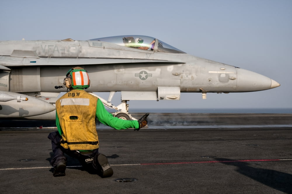 An FA-18C is ready to launch from the flight deck of USS Eisenhower Canvas Art - Giovanni CollaStocktrek Images (35 x 24)