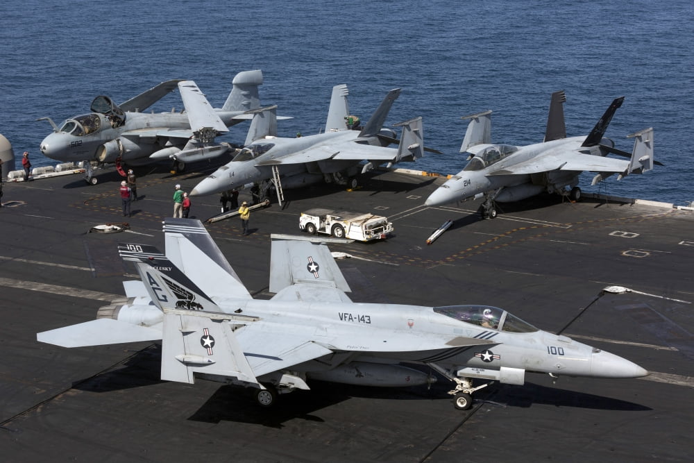 An FA-18E Super Hornet during flight operations on USS Dwight D Eisenhower Canvas Art - Gert KromhoutStocktrek Images (18 x 12)