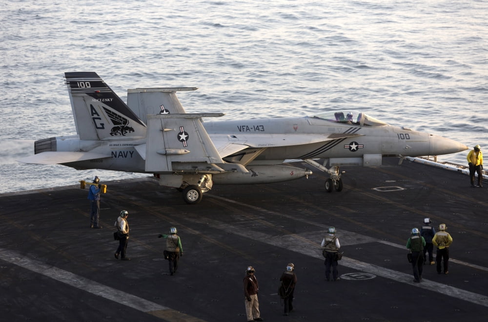 An FA-18E Super Hornet during flight operations on USS Dwight D Eisenhower Canvas Art - Gert KromhoutStocktrek Images (18 x 12)