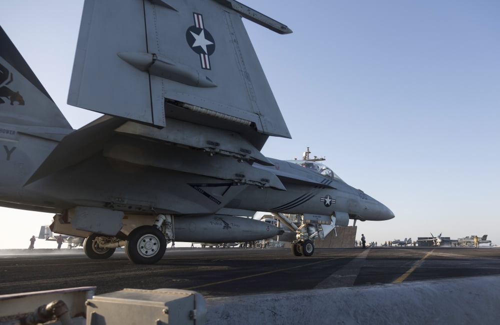 An FA-18E Super Hornet during flight operations on USS Dwight D Eisenhower Canvas Art - Gert KromhoutStocktrek Images (18 x 12)