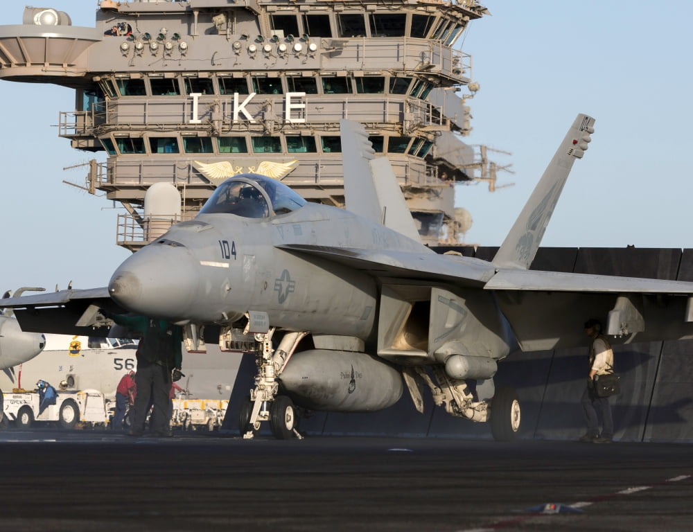 An FA-18E Super Hornet during flight operations on USS Dwight D Eisenhower Canvas Art - Gert KromhoutStocktrek Images (32 x 25)