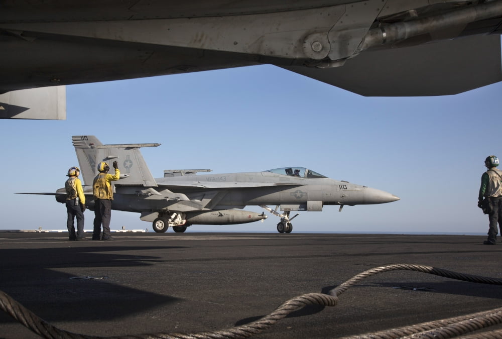 An FA-18E Super Hornet during flight operations on USS Dwight D Eisenhower Canvas Art - Gert KromhoutStocktrek Images (34 x 23)