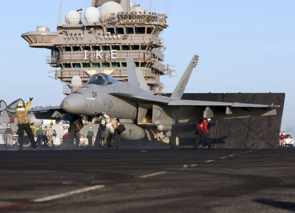 An FA-18E Super Hornet during flight operations on USS Dwight D Eisenhower Canvas Art - Gert KromhoutStocktrek Images (34 x 25)
