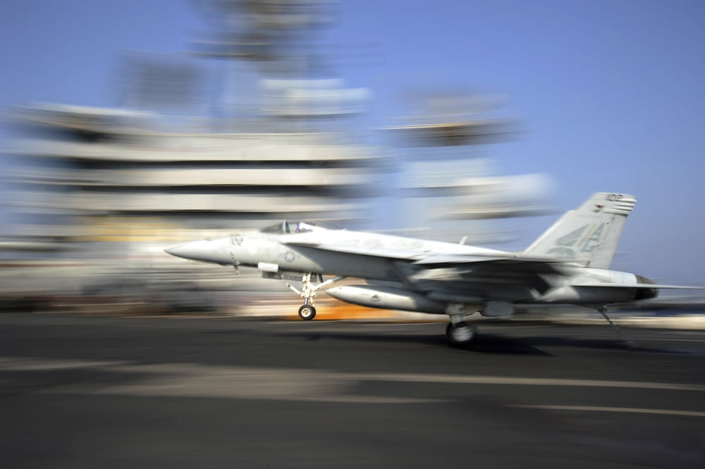 An FA-18E Super Hornet lands aboard USS Dwight D Eisenhower Canvas Art - Stocktrek Images (35 x 23)