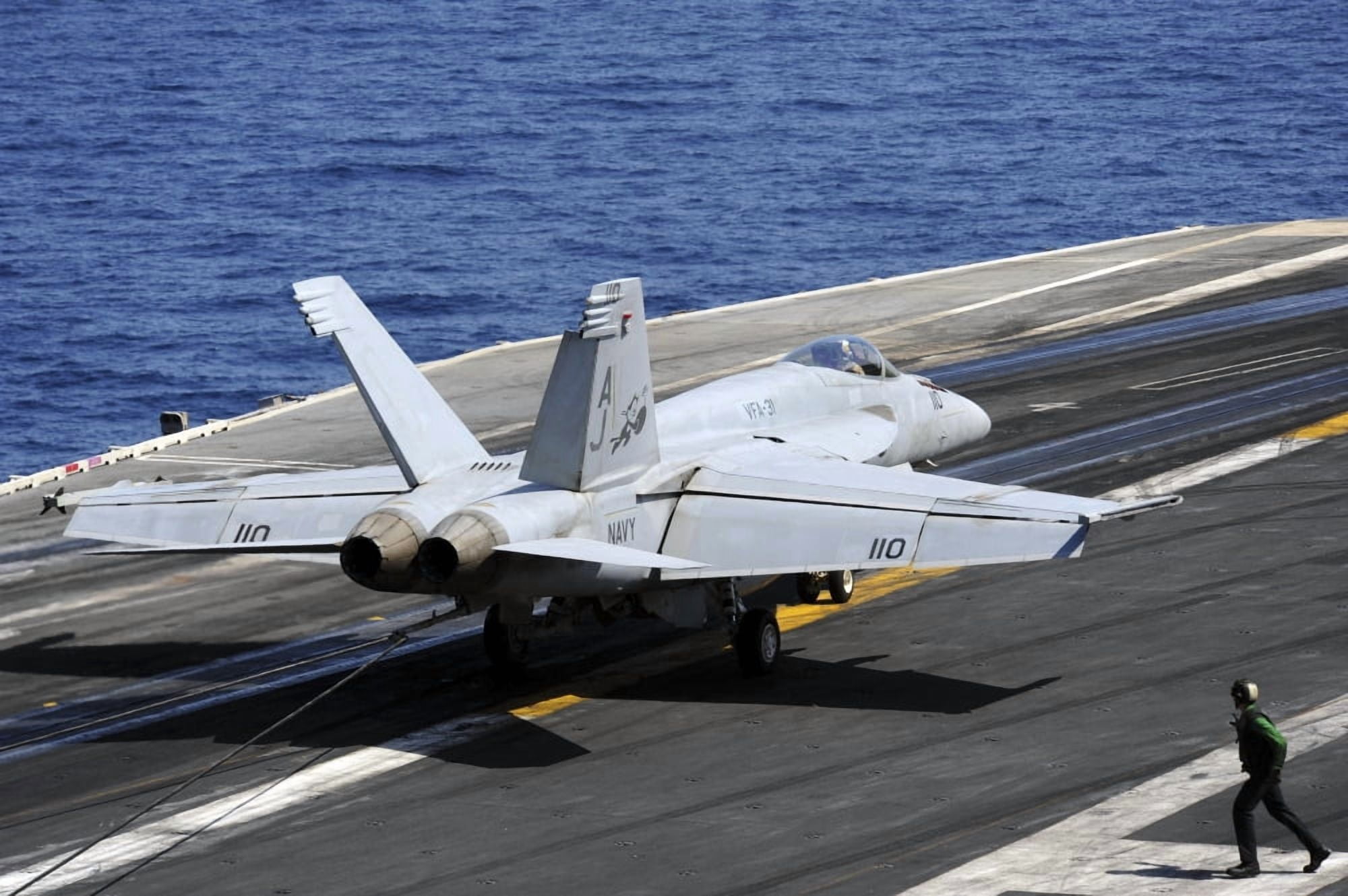 An FA-18E Super Hornet lands on the flight deck of USS George Washington Canvas Art - Stocktrek Images (34 x 23)