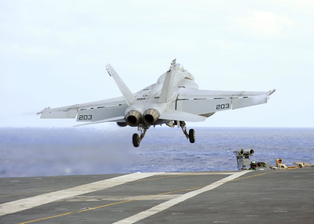 An FA-18E Super Hornet launches from the aircraft carrier USS George Washington Canvas Art - Stocktrek Images (34 x 24)