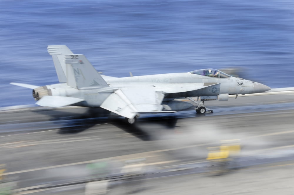 An FA-18E Super Hornet launches from the aircraft carrier USS George Washington Canvas Art - Stocktrek Images (35 x 23)