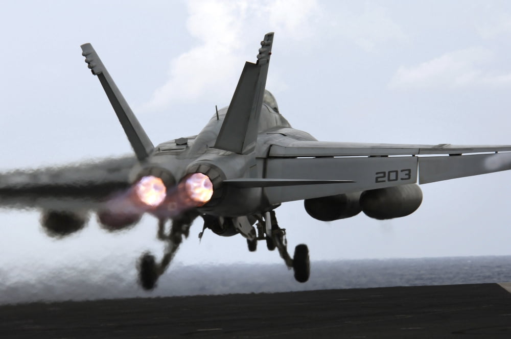 An FA-18E Super Hornet launches off the flight deck of USS Kitty Hawk Canvas Art - Stocktrek Images (34 x 23)