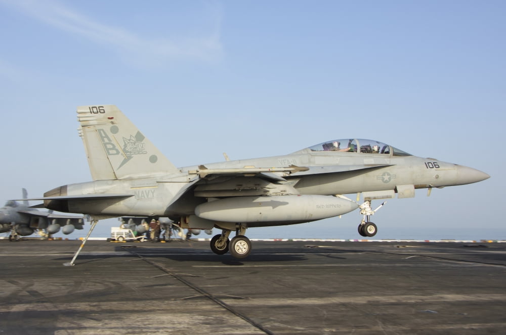 An FA-18E Super Hornet makes an arrested landing aboard an aircraft carrier Canvas Art - Giovanni CollaStocktrek Images (17 x 12)
