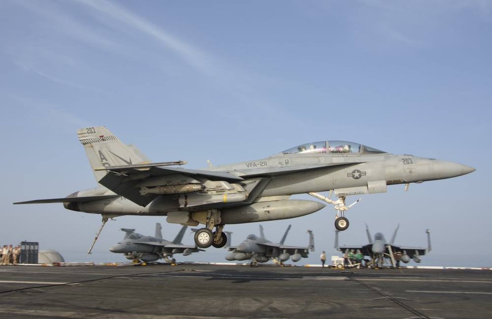 An FA-18E Super Hornet makes an arrested landing aboard an aircraft carrier Canvas Art - Giovanni CollaStocktrek Images (18 x 12)