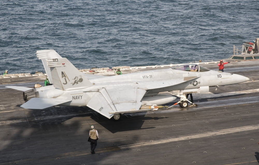 An FA-18E Super Hornet on the flight deck of USS George HW Bush Canvas Art - Giovanni CollaStocktrek Images (18 x 11)