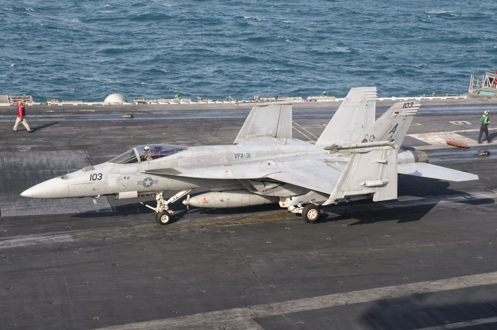 An FA-18E Super Hornet on the flight deck of USS George HW Bush Canvas Art - Giovanni CollaStocktrek Images (35 x 23)