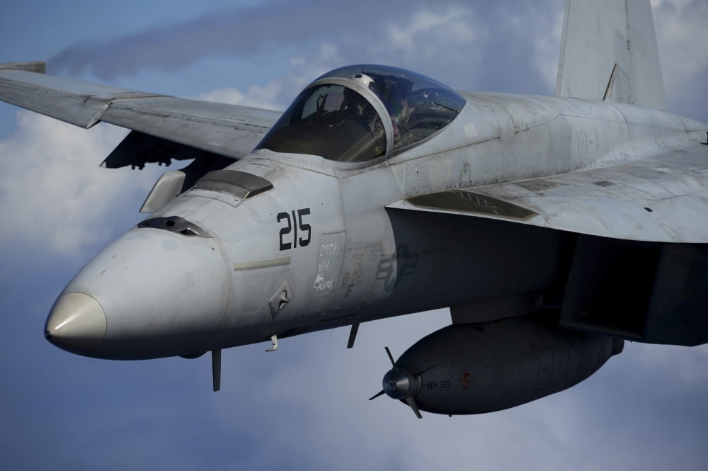 An FA-18E Super Hornet over the Pacific Ocean Canvas Art - Stocktrek Images (35 x 23)
