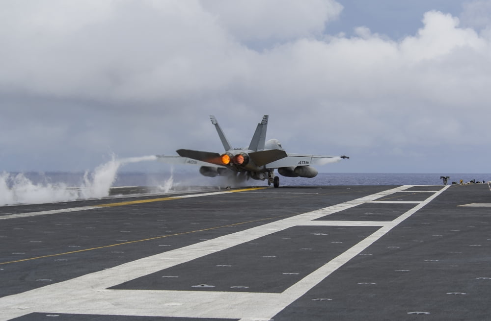 An FA-18E Super Hornet takes off from the flight deck of USS George Washington Canvas Art - Stocktrek Images (35 x 23)