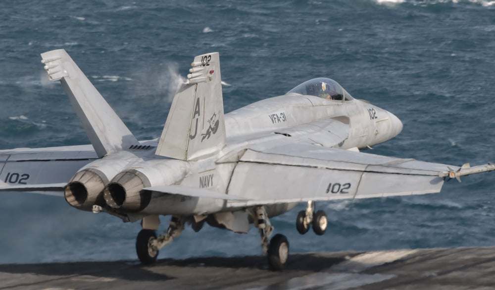 An FA-18E Super Hornet taking off from USS George HW Bush Canvas Art - Giovanni CollaStocktrek Images (37 x 22)