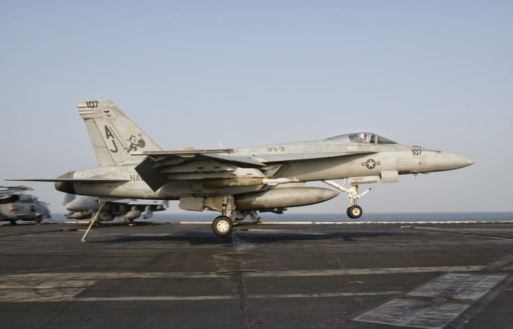 An FA-18E Super Hornet trap landing aboard USS George HW Bush Canvas Art - Giovanni CollaStocktrek Images (18 x 12)