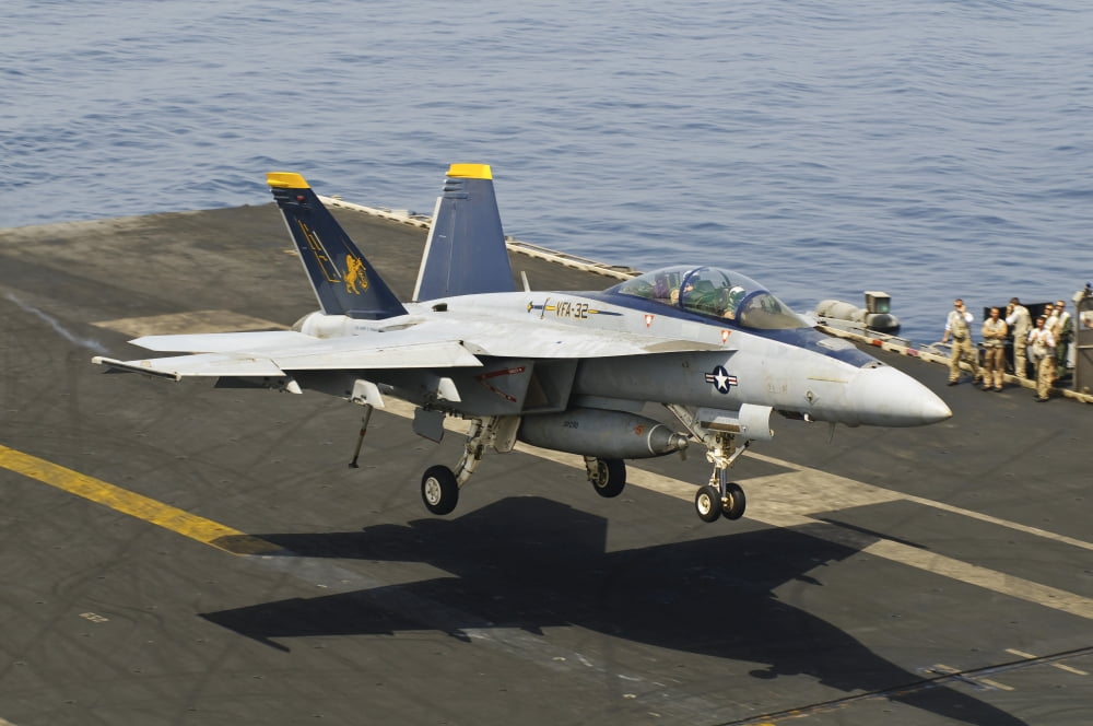 An FA-18E Super Hornet trap landing on the flight deck of USS Harry S Truman Canvas Art - Giovanni CollaStocktrek Images (18 x 12)