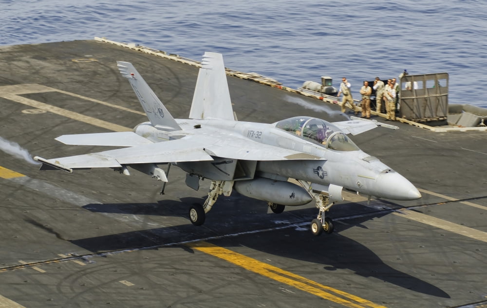 An FA-18E Super Hornet trap landing on the flight deck of USS Harry S Truman Canvas Art - Giovanni CollaStocktrek Images (35 x 23)