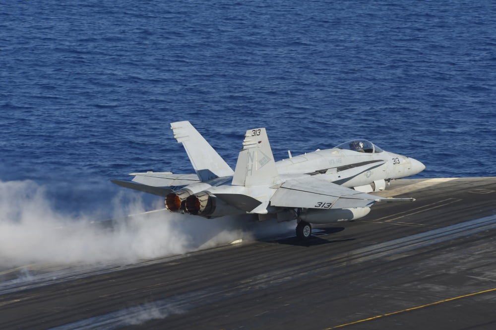 An FA-18F Hornet launches from the flight deck of USS Nimitz Canvas Art - Stocktrek Images (34 x 23)