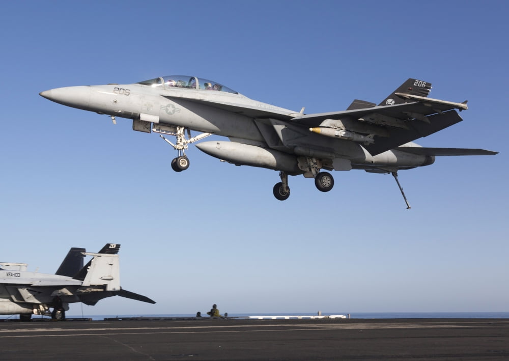 An FA-18F Super Hornet during flight operations on USS Dwight D Eisenhower Canvas Art - Gert KromhoutStocktrek Images (33 x 24)