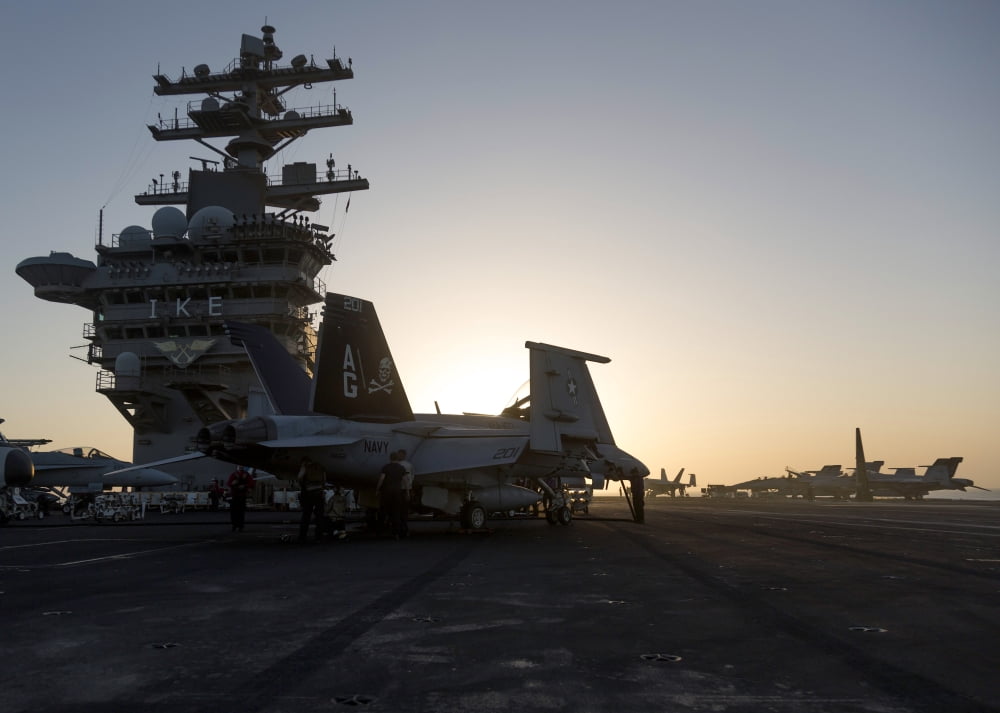 An FA-18F Super Hornet is inspected aboard USS Dwight D Eisenhower Canvas Art - Gert KromhoutStocktrek Images (17 x 12)