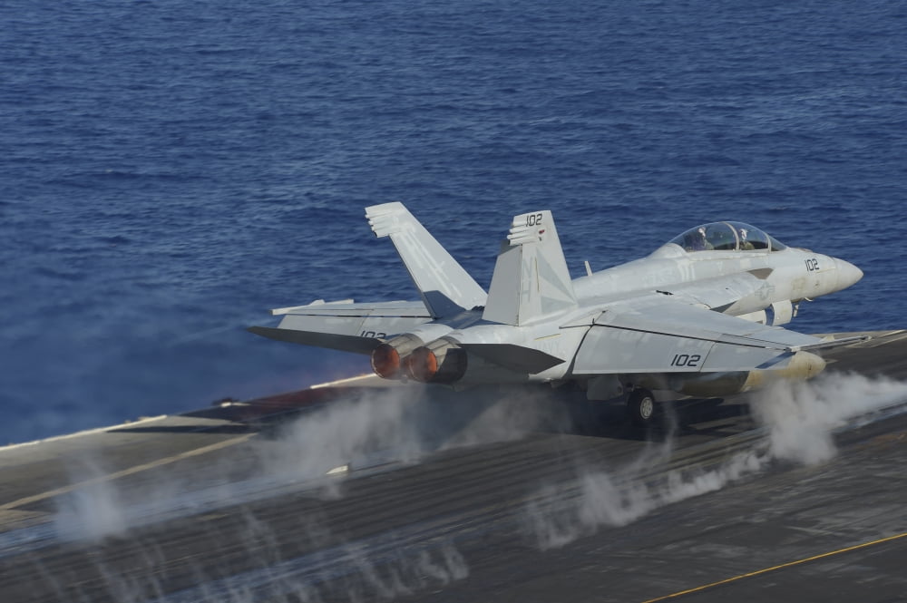 An FA-18F Super Hornet launches from the flight deck of USS Nimitz Canvas Art - Stocktrek Images (34 x 23)