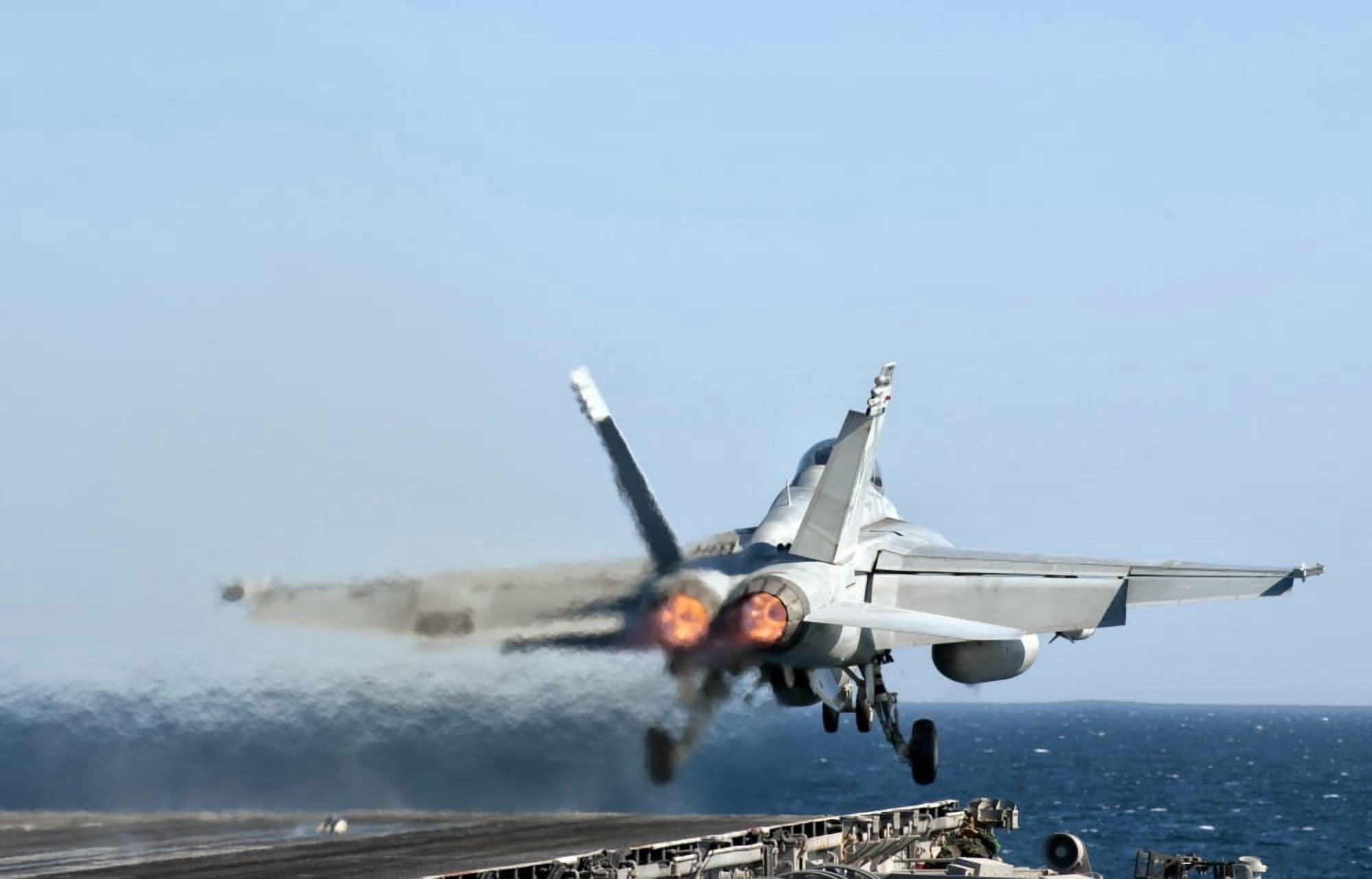 An FA-18F Super Hornet launches from the flight deck of aircraft carrier USS Nimitz Canvas Art - Giovanni CollaStocktrek Images (35 x 23)